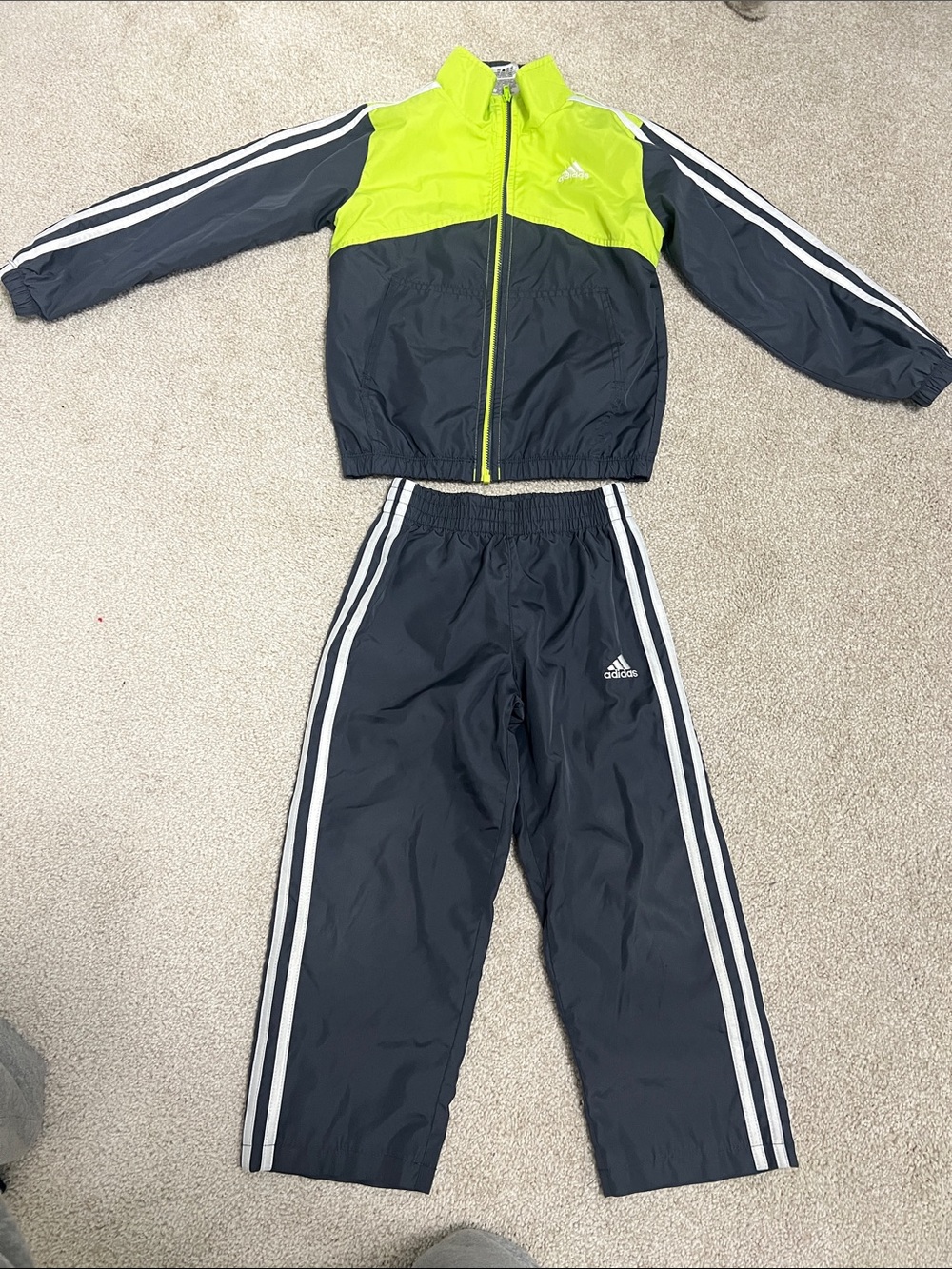 ' Adidas kids neon green and charcoal tracksuit with iconic white stripes